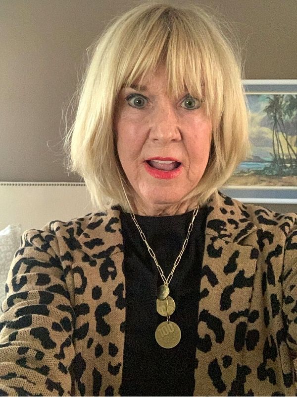 coin cluster necklace worn with leopard skin jacket